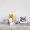 imageCreative CoOp Ivory Stoneware Canister with Acacia Wood Lid Color and Natural 65quot round