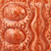 imageCreative CoOp Embossed TerraCotta Footed VasePlanter with Crackle Glaze Coral