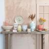 imageCreative CoOp Embossed TerraCotta Footed VasePlanter with Crackle Glaze Coral
