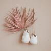 imageCreative CoOp Hanging Stoneware Planter with Jute Rope Hanger and Distressed Volcano Finish White