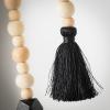 imageSullivans 65 ft Neutral Wood Bead ampamp Black Tassel Garland Set of 2 Artificial Greenery Versatile Garland Decor for All Seasons Perfect for Weddings Fireplace Mantels Dining and Living RoomsBlack  Tan