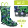 imageWestern Chief UnisexChild Kids Light Up Waterproof Rainboots with Handles for Easy on ampamp Off Rain BootDinosaur World