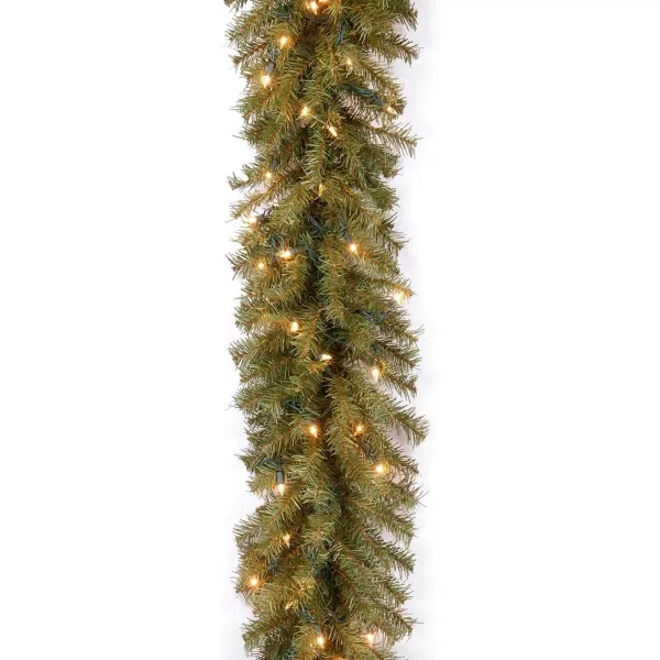 National Tree Company Prelit Artificial Christmas Tree For Entrances  Includes Prestrung White Lights and Stand  Montclair Spruce  5 ft4 ft Tree  Christmas Garland Green