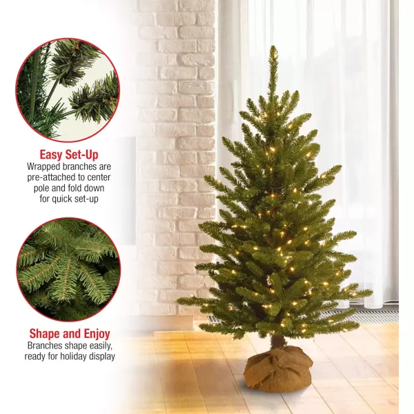 National Tree Company Prelit Artificial Mini Christmas Tree  Includes Small Lights and Cloth Bag Base  Kensington Burlap  4 ftTrees