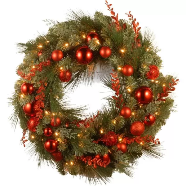 National Tree Company PreLit Artificial Christmas Wreath Green Evergreen White Lights Decorated with Ball Ornaments Red Sprigs Christmas Collection 24 Inches24Inch Christmas Red Mixed Wreath