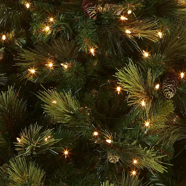 National Tree Company Feel Real Prelit Artificial Christmas Tree  Includes Prestrung White Lights  Flocked with Cones  Carolina Pine  9 ft65 ft Green