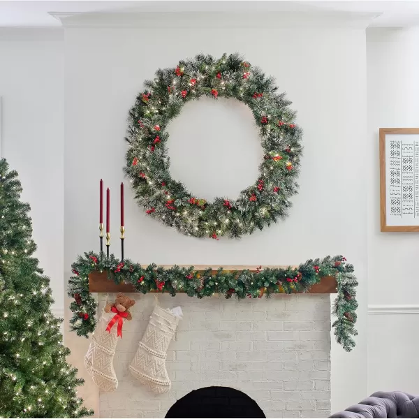 National Tree Company PreLit Artificial Christmas Wreath Green Wintry Pine White Lights Decorated with Pine Cones Berry Clusters Frosted Branches Christmas Collection 60 Inches48 in Wreath