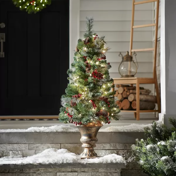 National Tree Company PreLit Artificial Entrance Christmas Tree Green Crestwood Spruce White Lights Decorated with Pine Cones Berry Clusters Frosted Branches Includes Pot Base 5 Feet4 ft Tree