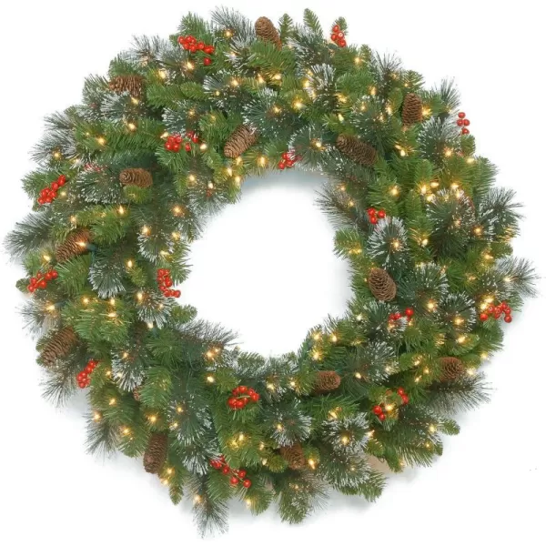 National Tree Company PreLit Artificial Christmas Wreath Green Crestwood Spruce White Lights Decorated with Pine Cones Berry Clusters Christmas Collection 24 Inches30 inch Battery Operated