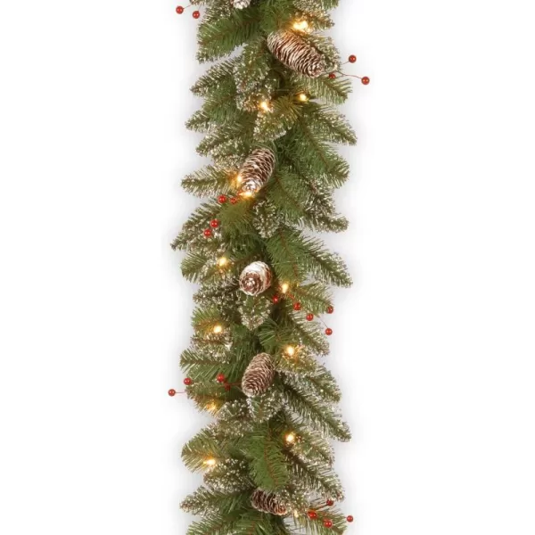 National Tree Company Prelit Artificial Christmas Garland  Flocked with Mixed Decorations and White Lights  Glittery Mountain Spruce  9 ft108X10X6 Green