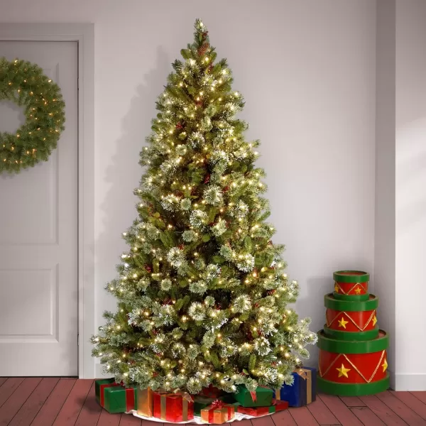 imageNational Tree Company Prelit Artificial Christmas Tree  Includes Prestrung White Lights and Stand  Flocked with Cones Red Berries and Snowflakes  Wintry Pine Slim  75 ft75 ft