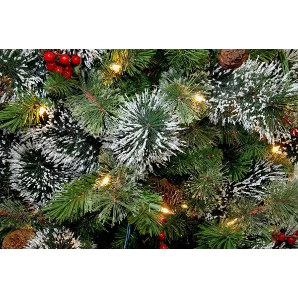 imageNational Tree Company Prelit Artificial Christmas Tree  Includes Prestrung White Lights and Stand  Flocked with Cones Red Berries and Snowflakes  Wintry Pine Slim  75 ft75 ft