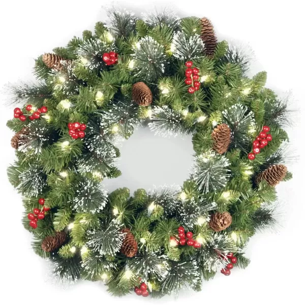 imageNational Tree Company PreLit Artificial Christmas Wreath Green Crestwood Spruce White Lights Decorated with Pine Cones Berry Clusters Frosted Branches Christmas Collection 24 Inches24 in