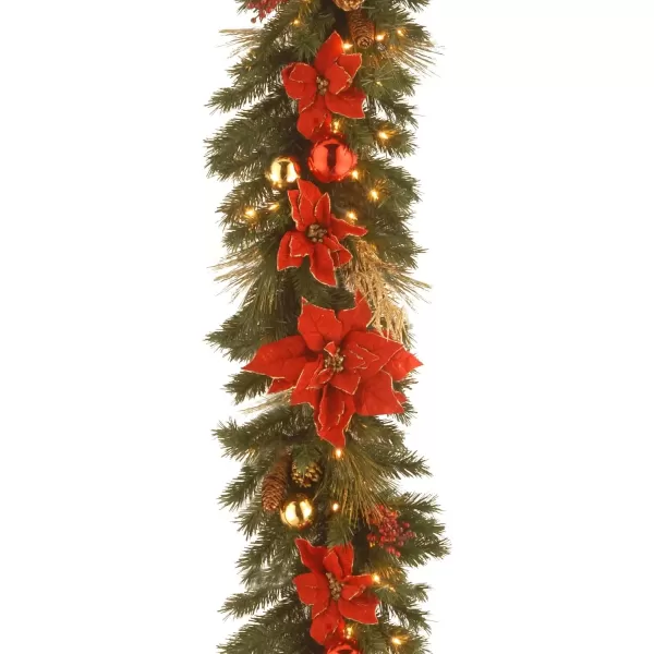 imageNational Tree Company PreLit Artificial Christmas Garland Green Evergreen White Lights Decorated With Pine Cones Golden Branches Ball Ornaments Poinsettia Flowers Plug In Christmas Collection 9 Feet9Foot x 12Inch