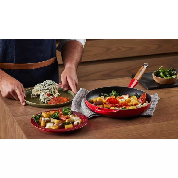 imageLe Creuset Enameled Cast Iron Alpine Wood Handle Fry Pan 1025quot LicoriceCerise