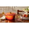 imageLe Creuset Enameled Cast Iron Signature Oval Dutch Oven 155 qt Flamme Doree with Crucible Knob45 Quarts