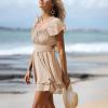 imageEXLURA Womens 2025 Summer Ruffle Short Sleeve Tie Back Romper Dress Square Neck A Line Cute Dressy Short JumpsuitsBeige