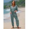 imageEXLURA Womens 2025 Summer Jumpsuits Casual Dressy One Piece Deep V Neck Batwing Short Sleeve Wrap Waist Romper with PocketsGrey Blue
